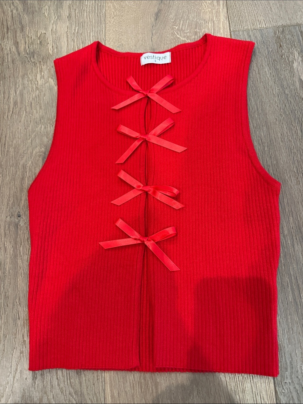 vestique Red Ribbed Sleeveless Top with Front Bow Ties